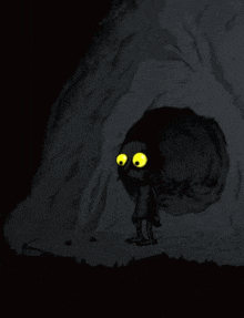 a cartoon character with big yellow eyes is standing in a cave with a fire coming out of it .