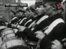 a black and white photo of a marching band with the date march 19 1915 on the bottom