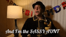 a man singing and holding a glass with the words and i 'm the sassy aunt