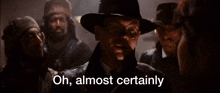 a man in a hat says oh almost certainly in front of a group of men