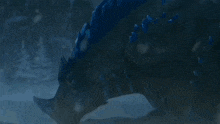 a blue explosion is coming out of a dark background