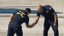Giving Dap The Blue Angels GIF - Giving Dap The Blue Angels Handshake GIFs