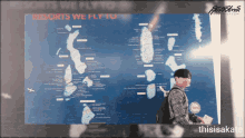 a man stands in front of a map that says resorts we fly to on it