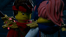 a couple of lego figures hugging each other with one wearing a red headband