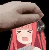 a picture of a girl with red hair and a hand covering her face