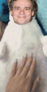 a pixelated image of a man with a white shirt on