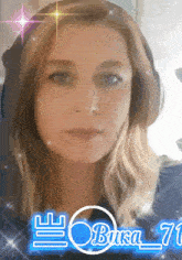 a woman wearing headphones has the name bursa_71 on her face
