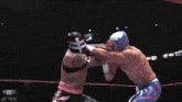 two wrestlers are fighting in a wrestling ring with the caption capcut