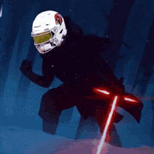 a person wearing a football helmet and holding a red light saber