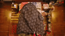 a person is laying on a bed with a blanket that says darth vader on it