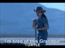 a girl in a cowboy hat says i 'm tired of this grandpas turtle
