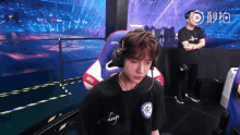a man wearing headphones and a shirt that says " change "