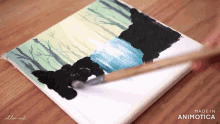 a painting is being painted on a canvas made in animatica