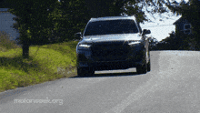 a car is driving down a road with the words motorweek.org written on the bottom