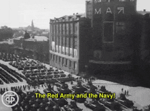 a black and white photo of a parade with the words " the red army and the navy "