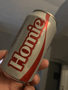 someone is holding a can of diet coke that says homie