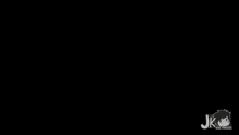 a purple sign that says `` wearite '' is glowing in the dark on a black background .