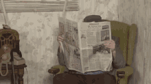 Reading Newspaper GIF - Reading Newspaper What GIFs