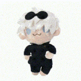 a stuffed toy of a person with white hair and sunglasses on their head .