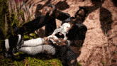 a man and a woman laying on the ground