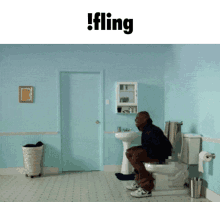 a man sits on a toilet in a bathroom with the word fling on the top