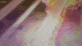 a colorful background with a bbc logo on the bottom right