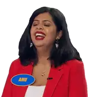 a woman wearing a red jacket has a blue name tag that says anu