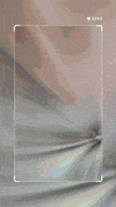 a phone screen shows a blurred image and the number 3762
