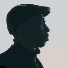 a man wearing a hat with the words la guarimba film festival written above him