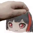 a hand is petting the head of a girl with red hair .