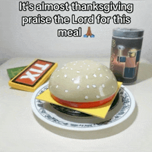 a hamburger on a plate with the words it 's almost thanksgiving praise the lord for this meal on the bottom