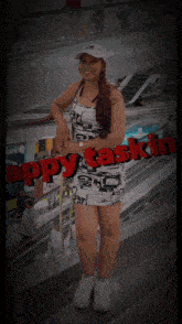 a woman in a dress is standing in front of an escalator with the words happy taskin on the bottom