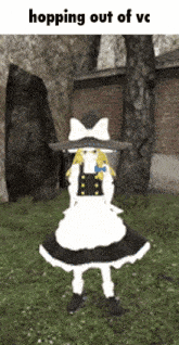 a girl in a black and white dress and hat is standing in a field .