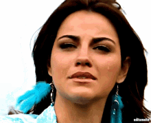 a close up of a woman 's face with editsmaite written below her