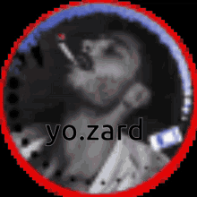 a blurry picture of a man smoking a cigarette with the name yo.zard written on the bottom