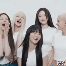 a group of young women are posing for a picture and the letters ms are on the bottom right