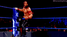 a blurry picture of a wrestler in a ring with the nextbigthing written on the bottom right