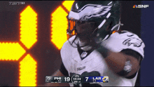 a football game is being played between the eagles and the larams