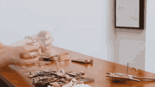 a wooden table with a lot of pieces on it