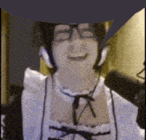 a woman wearing headphones and a maid costume is smiling