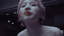 a close up of a woman 's face with a sign in the background that says ' smoking '