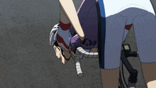 a person wearing a purple shirt with the letter m on it is standing next to a bicycle