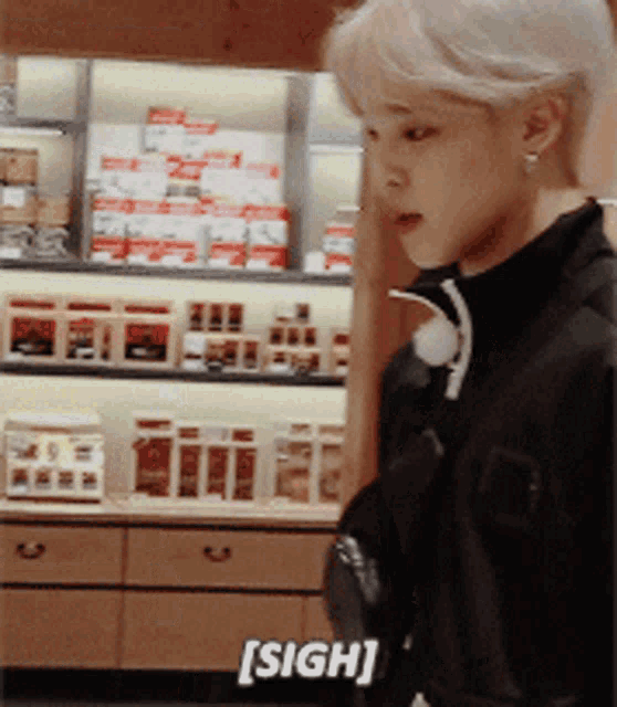 Gif of BTS Jimin sighing with a sigh animation