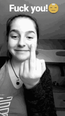 a girl is giving the middle finger with the words fuck you written above her