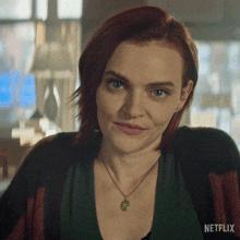 a close up of a woman 's face with netflix written on the bottom