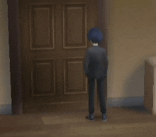 a man in a suit and a girl in a red jacket are standing in a doorway .