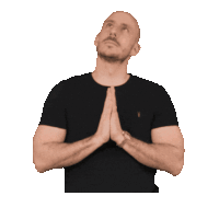 a man in a black shirt is praying with the word amin written below him