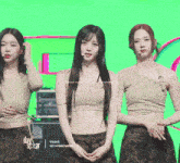 three girls are standing in front of a green background with triples written on it