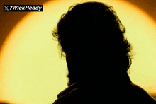 a silhouette of a man with the name 7wick reddy on the top