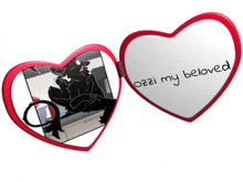 a heart shaped mirror says " ozzi my beloved " on it